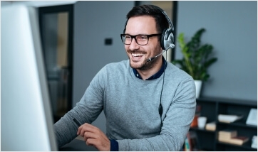 a VersaCourt team member at a computer ready to answer your questions
