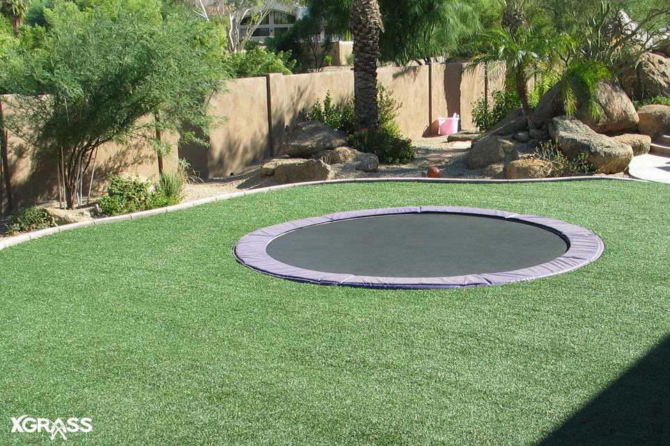 Backyard with artificial grass lawn