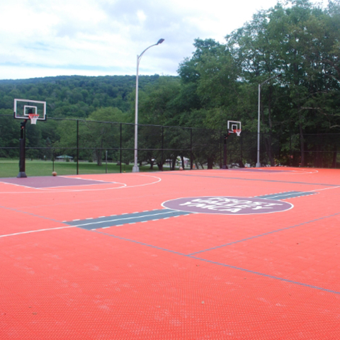 a large, colorful basketball court to serve a community