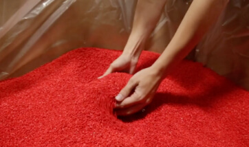 plastic pellets in a vivid red color