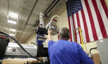 robotics working in conjunction with a human technician in court tile manufacturing process