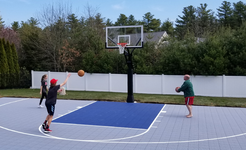 Family playing basketball in Austin, Texas