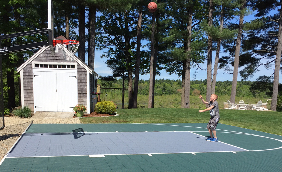 Baltimore kid playing basketball on court
