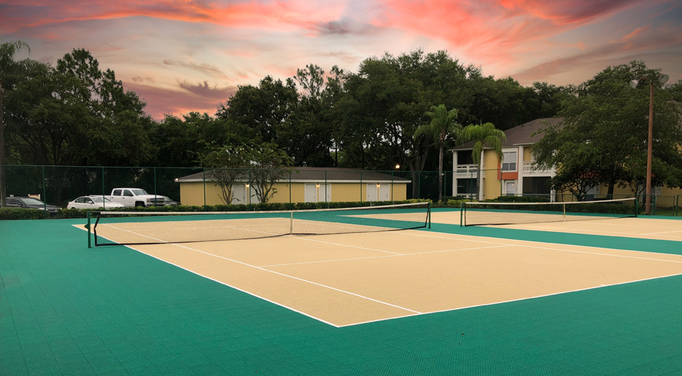 Green and tan commercial tennis court