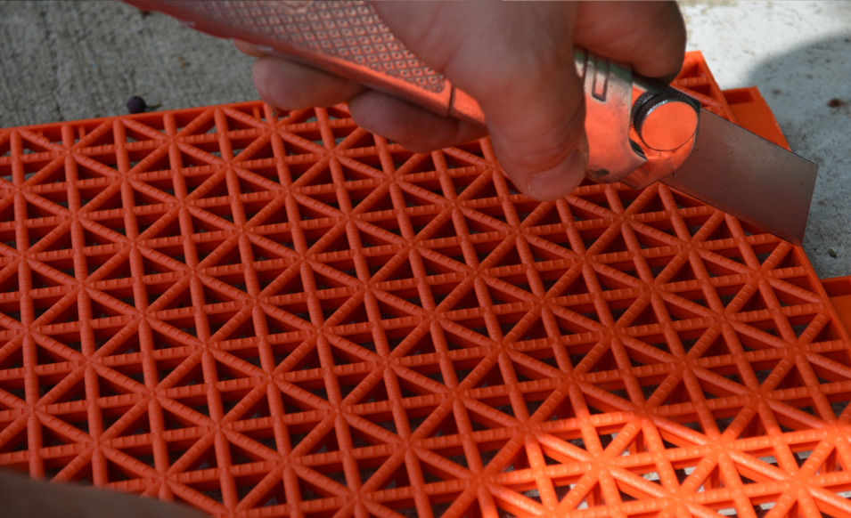 Cutting orange game tile with a box knife