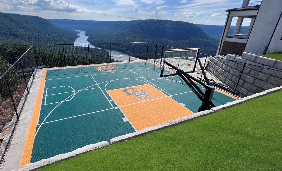 residential basketball court next to golf course