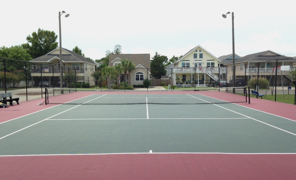 residential basketball court next to mini golf and swimming pool