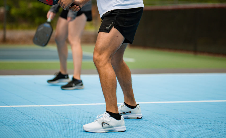 a closeup of people playing on VersaCourt pickleball court