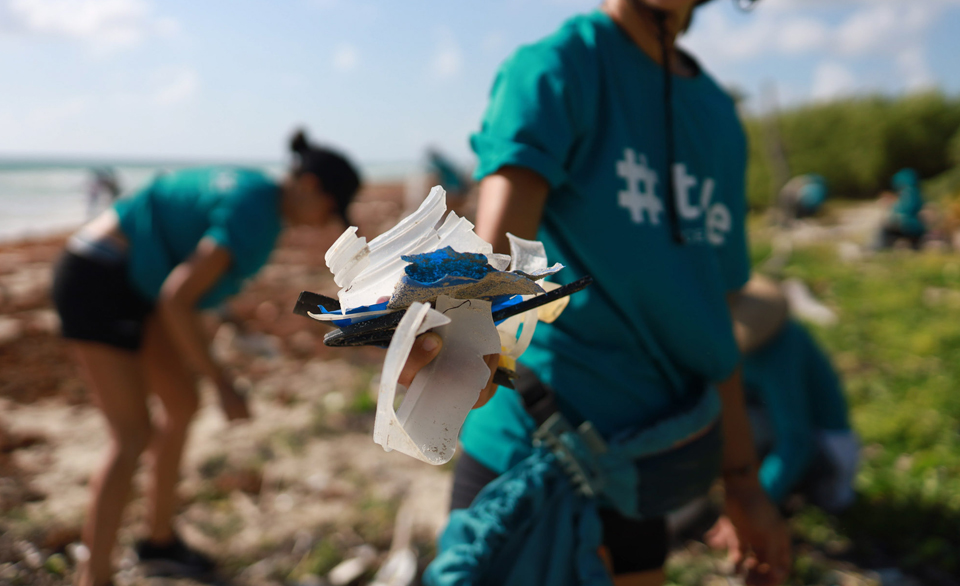Tide Employee Cleaning Up Plastic off Beach
