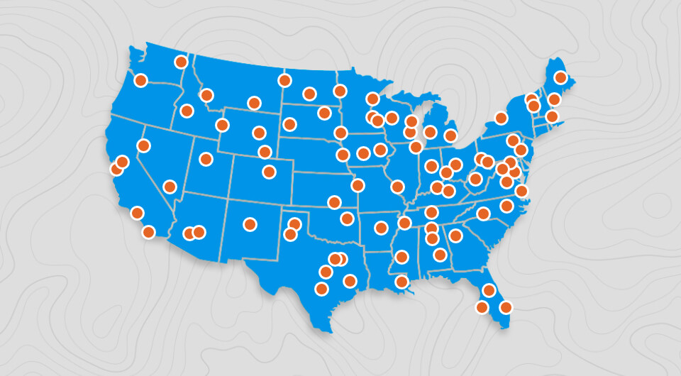 US map illustration with hundreds of dots indicating VersaCourt distributors across the country